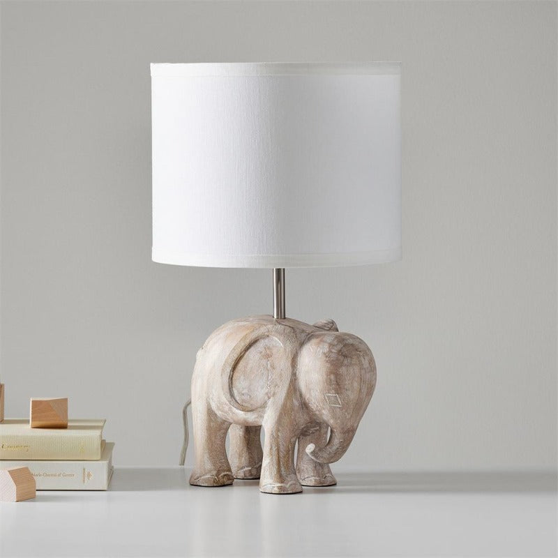 Lampe de table en bois sculpté avec animaux