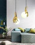 Load image into Gallery viewer, Hand Holding Globe Pendant Light
